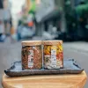 Hộp quà vỏ bưởi sấy và trà gạo lứt mang đậm đà hương vị Việt, được đóng gói tinh tế trong hộp quà quấn khăn cổ điển, chứa thành phần tự nhiên an toàn, là set quà đặc sản truyền thống và món quà tặng tốt cho sức khỏe.