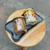 Hộp quà vỏ bưởi sấy và trà gạo lứt mang đậm đà hương vị Việt, được đóng gói tinh tế trong hộp quà quấn khăn cổ điển, chứa thành phần tự nhiên an toàn, là set quà đặc sản truyền thống và món quà tặng tốt cho sức khỏe.Hộp quà vỏ bưởi sấy và trà gạo lứt mang đậm đà hương vị Việt, được đóng gói tinh tế trong hộp quà quấn khăn cổ điển, chứa thành phần tự nhiên an toàn, là set quà đặc sản truyền thống và món quà tặng tốt cho sức khỏe.