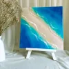 Smooth epoxy resin art measuring 30 x 30cm captures gentle ocean beauty through 3D epoxy resin seascape techniques, creating handcrafted wall art perfect as meaningful housewarming gift.