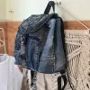 Flap mini backpack crafted from old jeans offers exclusive one-off design just for you, combining upcycled fashion sensibility with distinctive denim style as creative birthday gift and meaningful eco-friendly present.