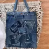 Slim bottom tote crafted from old jeans creates an exclusively yours accessory, combining upcycled materials with fashion-forward design as sustainable fashion statement and meaningful eco-friendly handmade gift