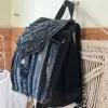 Layered mini backpack crafted from old jeans ignites your personal style through upcycled fabric design, combining rugged fashion aesthetic with environmental consciousness as unique recycled accessory and creative birthday gift