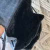 Layered mini backpack crafted from old jeans ignites your personal style through upcycled fabric design, combining rugged fashion aesthetic with environmental consciousness as unique recycled accessory and creative birthday gift