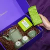 Tea set with Ancient Snow Shan Tea gift box showcasing premium Bat Trang ceramics and traditional tasting artistry, presented as an exclusive Vietnamese cultural souvenir with personalized card.