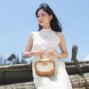 Mini Petal Woven rattan handbag compact embracing pure essence, handcrafted compact handbag sustainable fashion as Vietnamese souvenirs
