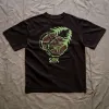 The "Here To Hear" cotton T-shirt connects nature and time with a creative design and comfortable fabric, perfect for travel, adventures, or as a birthday gift.