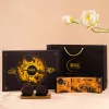 “Brown Moonlight” gift box with 4 chocolate mooncakes, assorted chocolates, nuts & cutlery set – premium Mid-Autumn corporate gift.