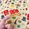 Bộ 2 tấm sticker "Around Vietnam" với 28 hình dán độc quyền, mang đến những góc nhìn rực rỡ về Việt Nam, thích hợp trang trí sổ tay và làm quà lưu niệm ý nghĩa.