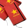 Sổ tay "Tôi Yêu Việt Nam" với thiết kế cờ đỏ sao vàng tung bay, mang phong cách vintage, là món quà lưu niệm Việt Nam độc đáo dành cho đồng nghiệp và bạn bè.