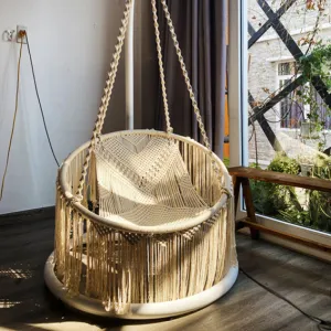 macrame hanging hammock chair, supports heavy weight, resistant to moths, adds a touch of elegance to any space