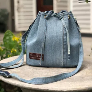 drawstring bucket bag from old jeans, youthful and eye-catching design, dynamic and mischievous style