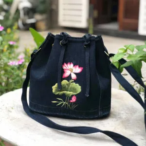 lotus embroidery denim bucket bag from old jeans, bold vietnamese traditional style, feminine and elegant