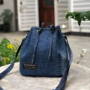 dark blue drawstring denim bucket bag from old jeans, youthful design, dynamic and stylish, compact yet spacious