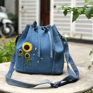 sunflower embroidery denim bucket bag from old jeans, size 21, leather lining inside, playful and youthful style, high craftsmanship