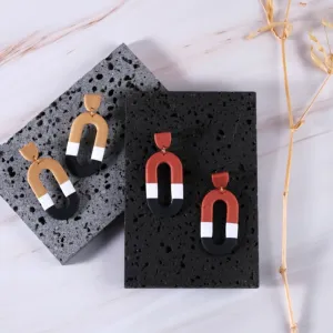 the magnet clay earrings, modeled after the magnet shape, fired clay material, unique and eye-catching design