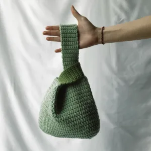matcha latte green crochet handbag, thick and durable knit material, high durability, minimalist design, can be worn in various styles