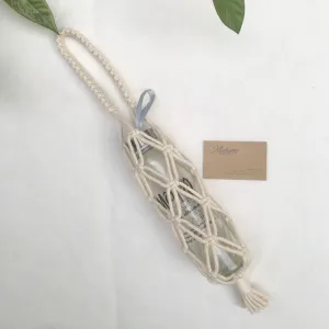macrame bottle holder, eye-catching and unique design, intricately knotted macrame button, durable material, reusable
