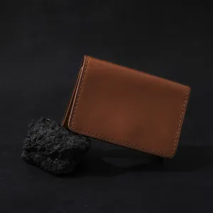 trifold brown vachetta wallet, minimalist design, sleek and sophisticated style, a gift for friends and family