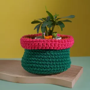 green with orange and deep pink border crochet cotton basket, impressive color scheme, intricate crochet technique, home decoration