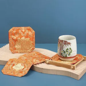 lotus on orange brocade coaster, orange color, luxurious silk fabric, traditional patterns, handcrafted product