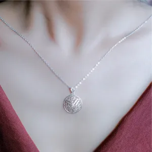 conical hat silver necklace, intricately designed pendant, elegant beauty, traditional silver craftsmanship, elegant jewelry