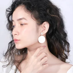 circle silver earrings, “thô” collection, impressively large earring face, captivating attention, suitable for evening dresses