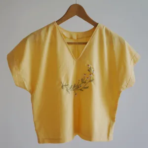 linen top with floral embroidery, lightweight and breathable material, colorfast, minimalist summer style