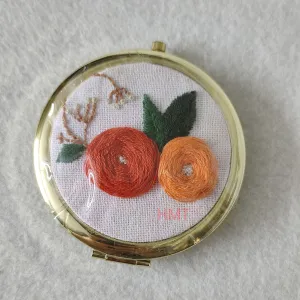 orange rose embroidered compact mirror, gentle and feminine design, sturdy mirror frame, compact handheld size, handmade product
