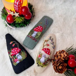 hand embroidery mushroom hair clip, inspired by amanita muscaria mushroom, mysterious and attractive style, vintage fairy style