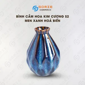 The Ocean Blue Fire-Glazed Diamond Ceramic Vase from Bat Trang Ceramic is an exquisite pottery vase that serves as a stunning stage for floral beauty, making it a perfect home decor piece and an ideal housewarming gifts