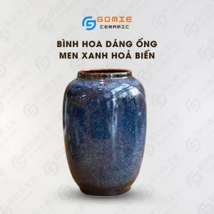 The Ocean Blue Fire-Glazed Ceramic Tube Vase from Bat Trang Ceramics is a minimalistic yet memorable cylinder pottery vase, perfect for home decoration or as a thoughtful housewarming gift.