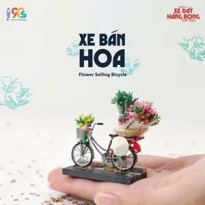 The Flower Selling Bicycle Magnet is a charming addition to our Vietnamese Street Cart Collection, perfect for home decor and a unique Vietnamese souvenir.