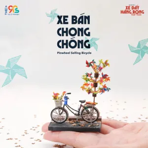 The Pinwheel Selling Bicycle Magnet is a charming addition to our Vietnamese Street Cart Collection, perfect for Vietnamese decor and a unique Vietnamese souvenir.