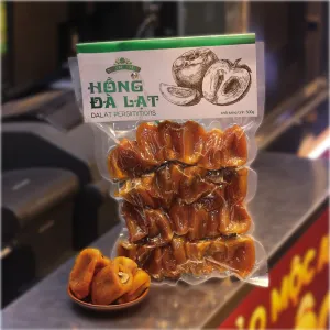 Da Lat Dried Specialties 500g pack, offering a delightful mix of sweet and savory treats like dried persimmons and chewy sweet potato, the perfect healthy snacks that showcase the essence of Vietnamese specialties with natural, nutritious dried fruits.