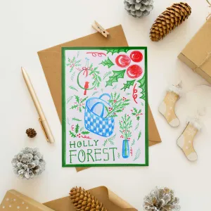 The "Holly Forest" Hand-Drawn Christmas Card features original artwork on a premium paper card with an elegant envelope and festive stickers - perfect as a thoughtful Christmas gift!