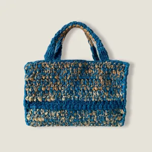 The Chani I Crochet Tote Bag from the Fremen Collection combines viscose and raffia to create a sustainable fashion accessory with a striking color combination, making it the perfect unique gift for her
