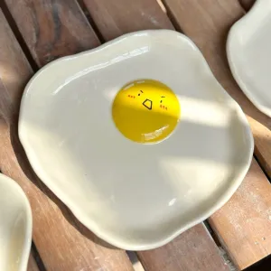 The Ceramic Egg Plate is a unique joy for every meal, featuring a handmade porcelain design that adds charm to your kitchen, making it the perfect gift for kids or a thoughtful birthday gift