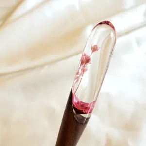 The Flowers Round-Headed Resin & Wooden Hair Stick, featuring an elegant flower pattern, is a perfect handmade accessory, making it an exquisite Vietnamese gift and a thoughtful birthday present for her.