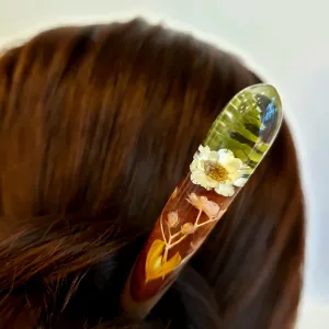 The Fern Snowy Resin & Wooden Hair Stick, crafted with a delicate design and durable wood material, showcases a unique sculpting technique, making it a perfect hair accessory and a thoughtful birthday gift for her