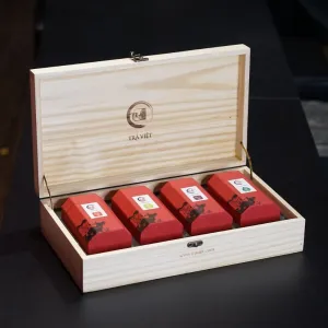 The Four Seasons Gift Box is a premium gift for the sophisticated, featuring a beautifully crafted pine wood box filled with exquisite Oolong tea, Black tea, Jasmine tea, and Green tea buds—a perfect partner gift that embodies elegance and tradition.