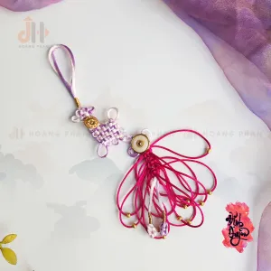 The "Pink Red" Heart-Knot Bond Cord is a unique Vietnamese gift that symbolizes tightening the marital bond, making it a meaningful Valentine’s gift, engagement gift, and Feng Shui accessory for couples destined to be together