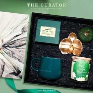 The "Peaceful" Gift Set, filled with love and care, is an elegant choice for her, featuring a Women's Day gift box with herbal tea, a ceramic mug, and a scented candle - perfect for birthdays and special occasions