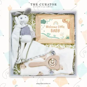 The "Happy Little Cutie" Gift Box is a heartfelt way to welcome the sweet baby with love, featuring a cozy cotton blanket, an adorable toy, and a charming photo frame - perfect for celebrating precious newborn moments.