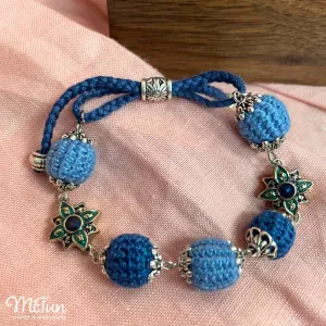 The Crochet Charm Bracelet - a delicate handmade piece that sways with every exquisite moment, blending intricate crochet craftsmanship with decorative charms, making it a heartfelt handmade gift for her.