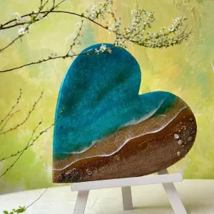 The Custom Ocean Heart Epoxy Resin Art beautifully captures the essence of love, blending Resin Ocean Artworks with timeless elegance, making it the perfect Tabletop Art, Gift for Lover, or Couple Gift to Preserve Love Eternally.