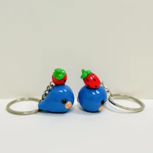 Melt with the cuteness of the Handmade Clay Strawberry-Hat Whale Keychain - an adorable handmade accessory that doubles as a unique bag charm and a thoughtful gift for her!