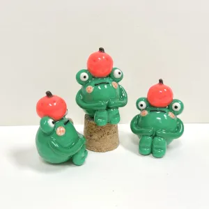 The Handmade Clay Orange-Hat Frog Figurine is a unique and humorous idea, crafted as an adorable decorative accessory and a cute clay toy, making it a charming and one-of-a-kind gift for her.