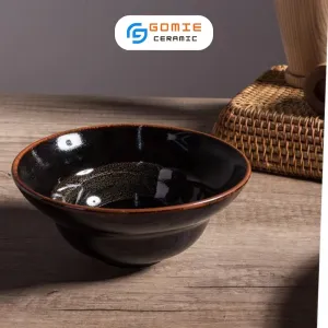 The Chestnut Brown Fire-Glazed Slender-Waisted Bowl, also known as the Chiet Yeu Bowl, is a stunning piece of Vietnamese traditional craftsmanship, embodying the elegance of Bat Trang ceramics—a perfect Vietnamese ceramic souvenir for those who appreciate artistry and heritage