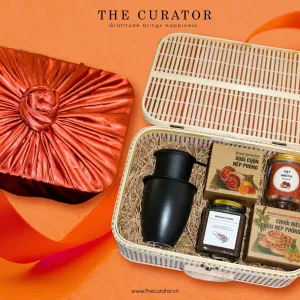 Discover the "Vietnam Flavor Treasure" Gift Set, a premium taste of Vietnam with specialty treats, a ceramic mug, and a traditional coffee filter
