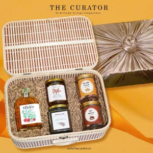 The "Essence Of Vietnam" Gift Set captures the preserved delicious flavors of Vietnam, featuring a refined selection of wine, coffee, honey, and nuts, making it a perfect Vietnamese gift and an elegant corporate gift box for any occasion